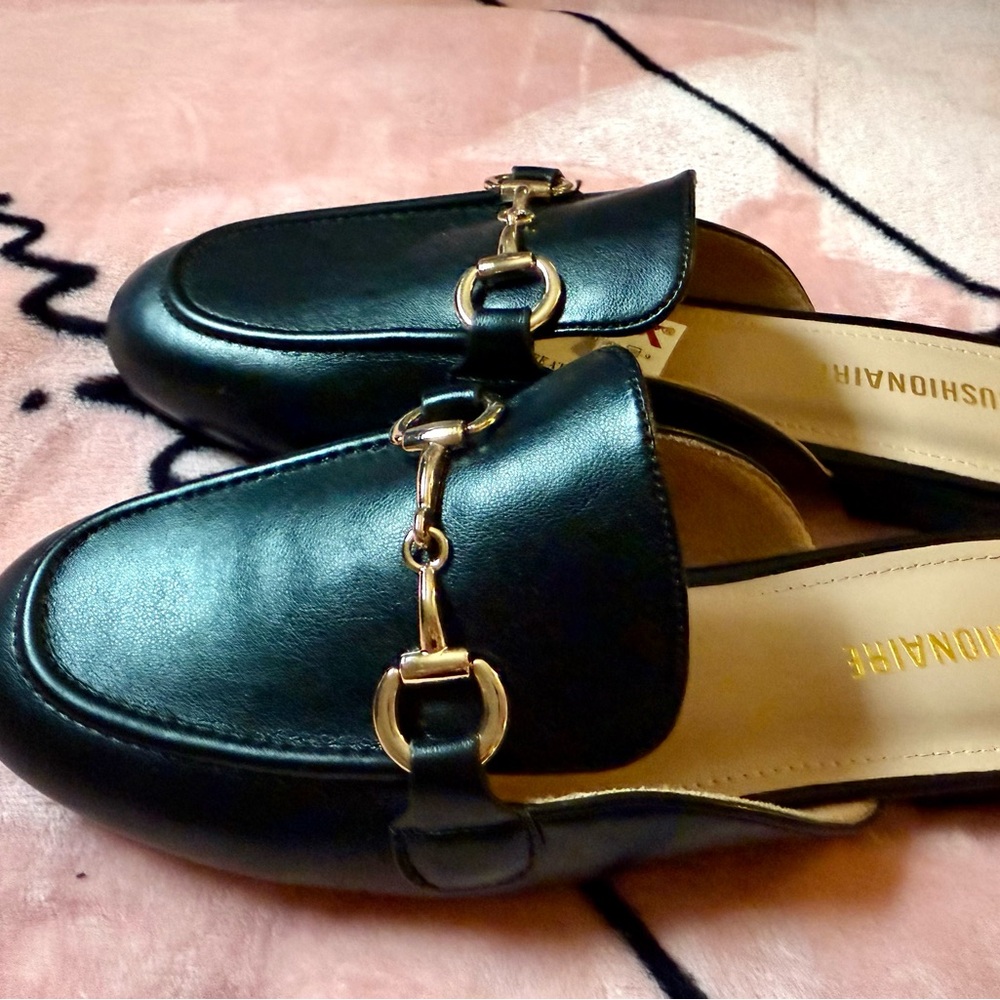 Fashionable Black Loafers with Gold Accents